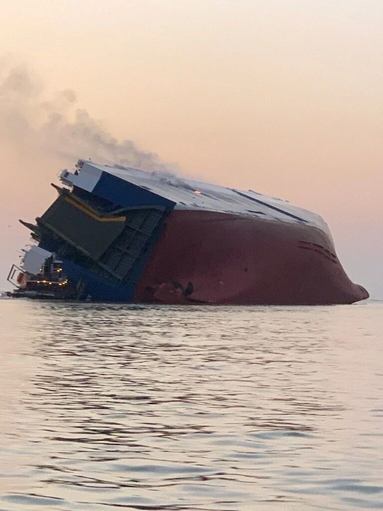 Coast Guard crews and port partners respond to a disabled cargo vessel with a fire on board September 8, 2019, in St. Simons Sound, Georgia. At approximately 2 a.m., Coast Guard Sector Charleston watch standers were notified of the M/V Golden Ray, a 656′ vehicle carrier, listing heavily in the St. Simons Sound with a total of 24 people on board; including 23 crew members and 1 pilot. Date